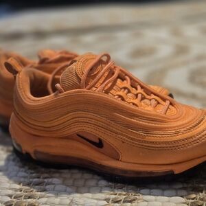 Slightly worn sz. 6.5 unisex Nike Atomic Orange Air Max 97.
